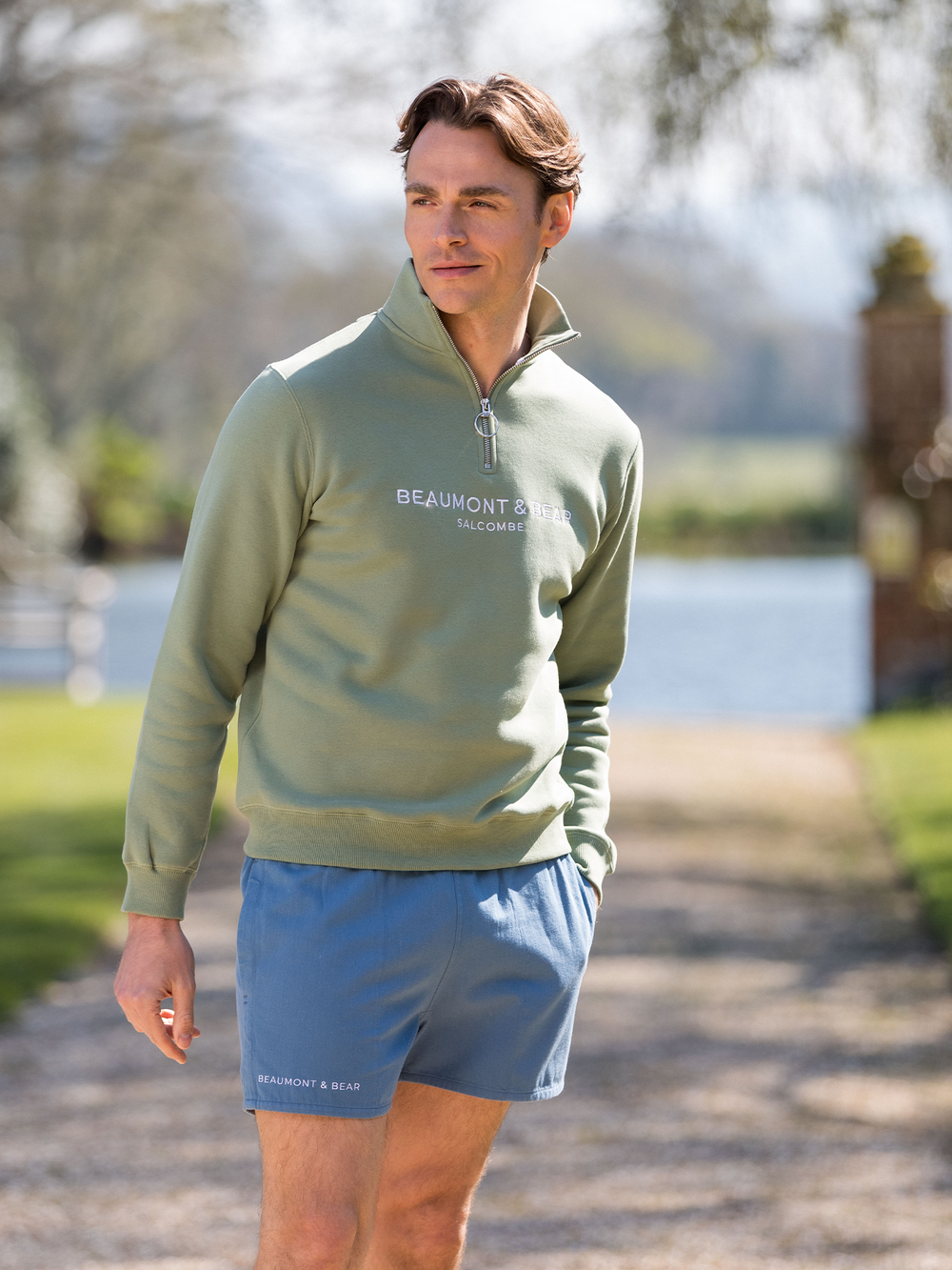 Men's vintage-style blue shorts featuring white embroidered Beaumont & Bear logo on lower right leg - classic summer fashion